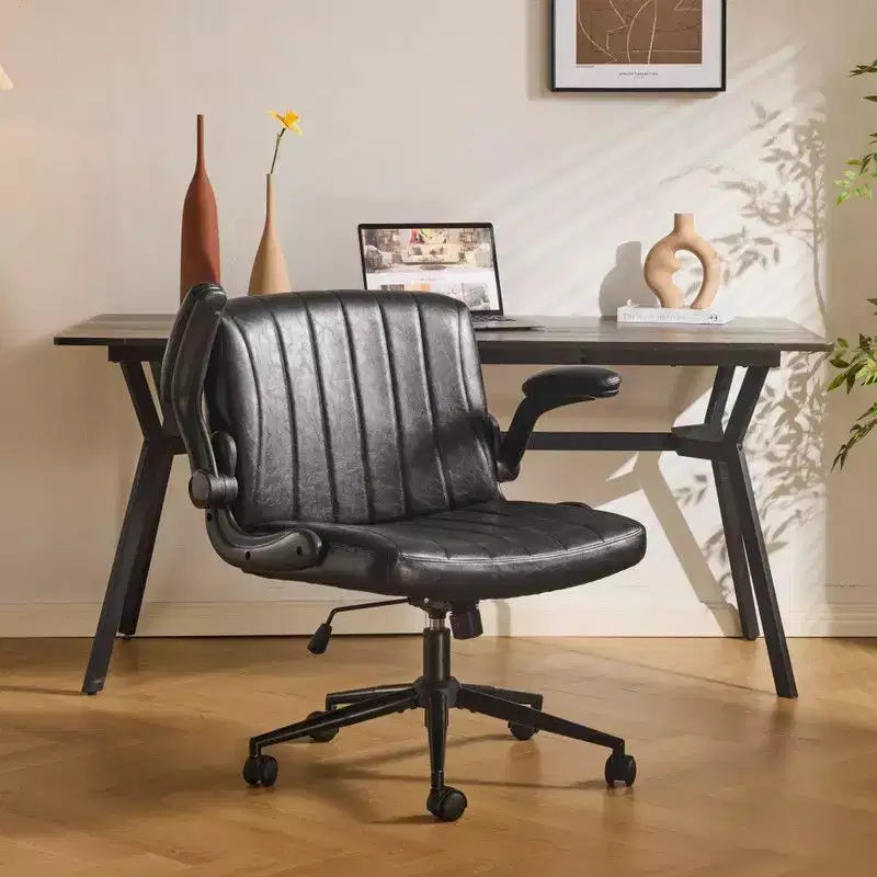 Fauteuil pivotant en cuir huilé avec accoudoirs relevables