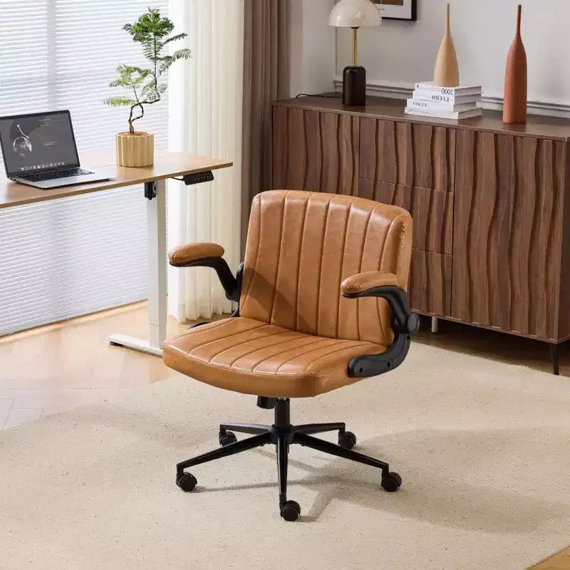 Fauteuil pivotant en cuir huilé avec accoudoirs relevables