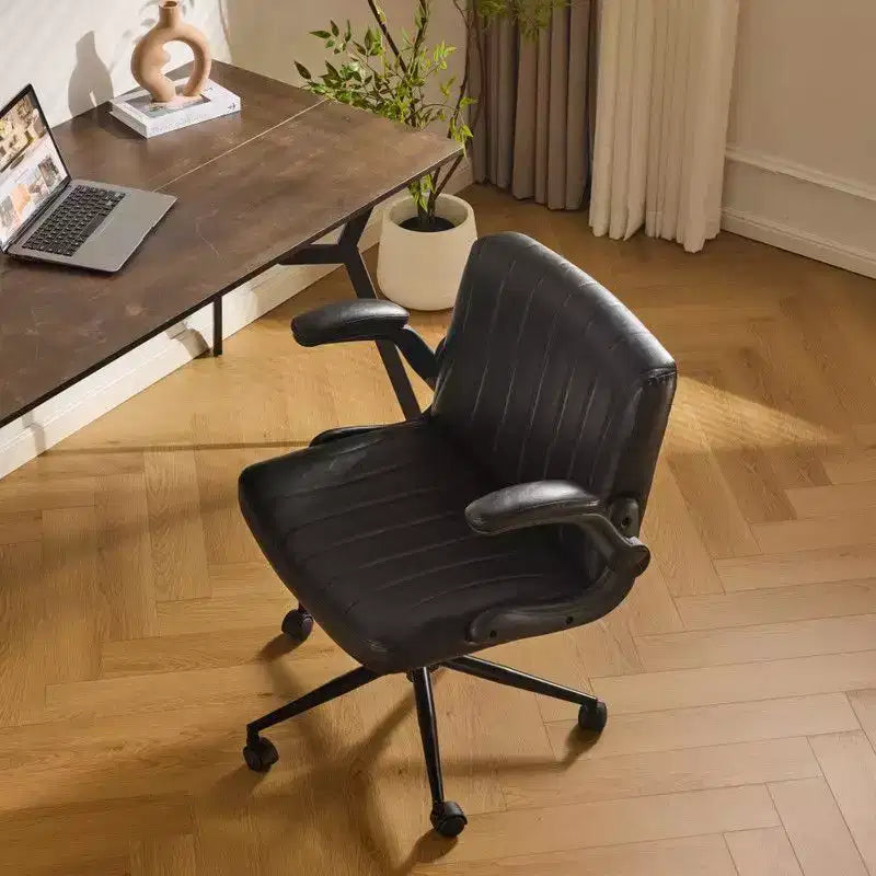 Fauteuil pivotant en cuir huilé avec accoudoirs relevables