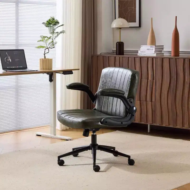 Fauteuil pivotant en cuir huilé avec accoudoirs relevables